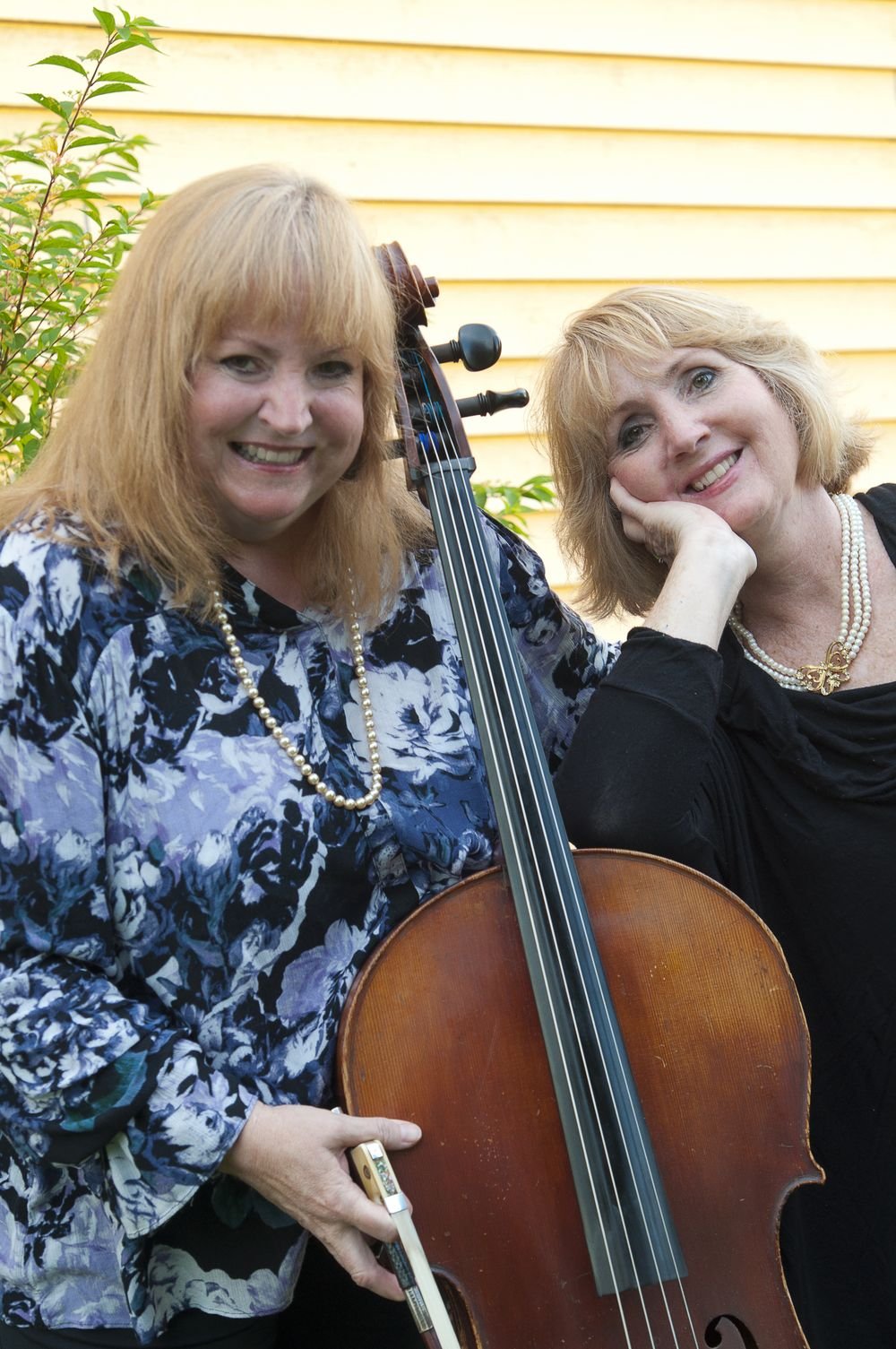 Laurie Haines Reese with cello and Tish Brown with violin