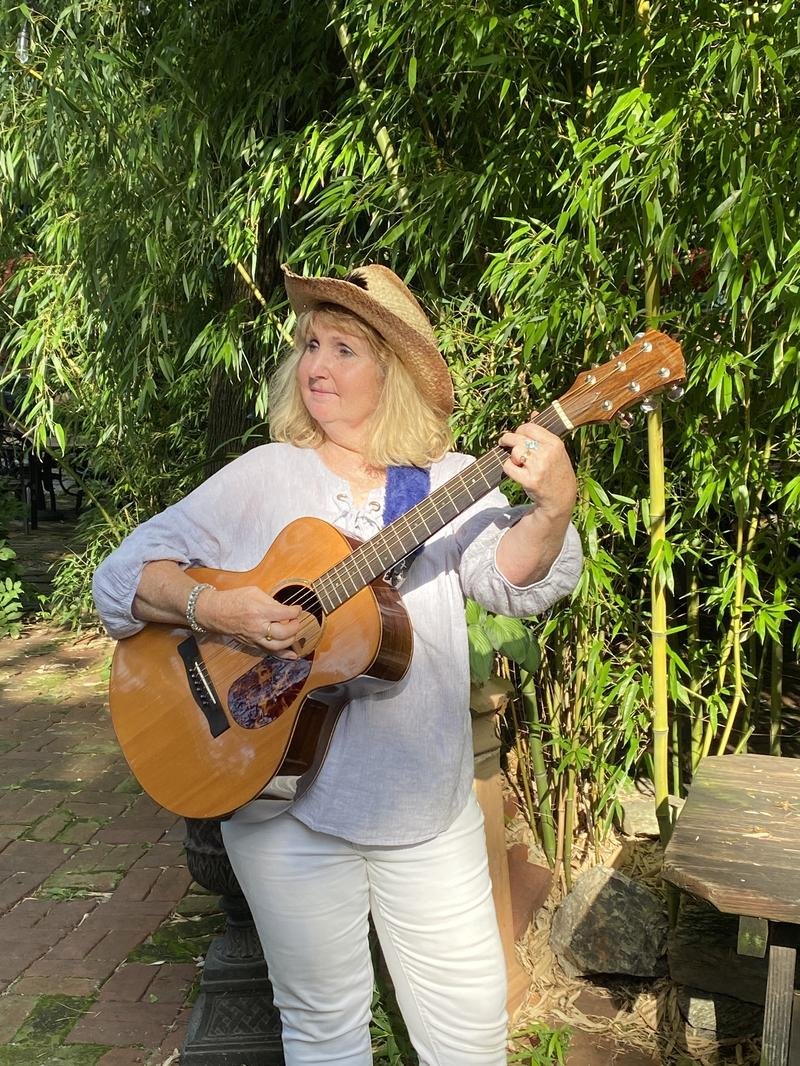 Tish Brown playing guitar